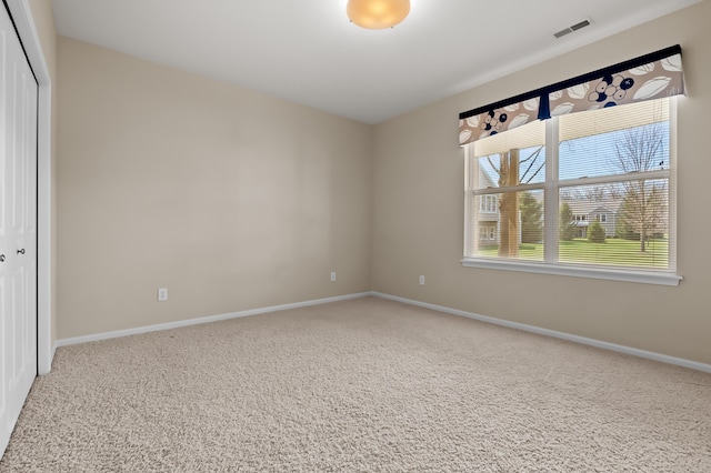interior space with baseboards and visible vents