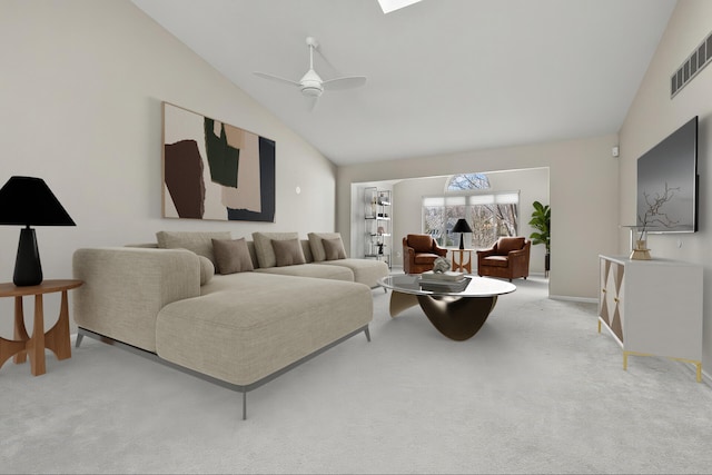 living room featuring visible vents, lofted ceiling, baseboards, light colored carpet, and a ceiling fan