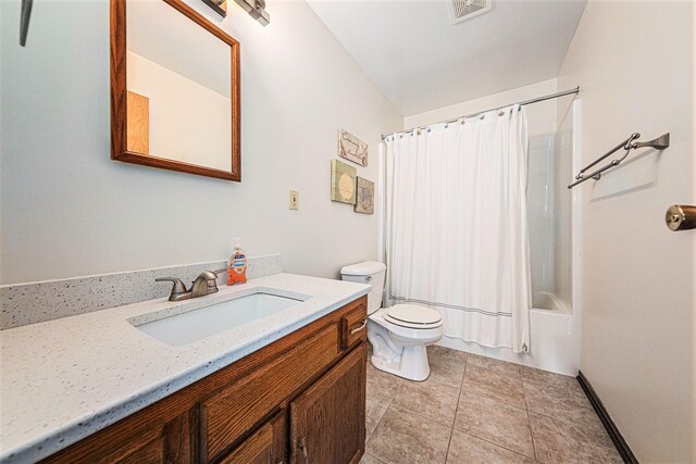 full bath with vanity, shower / tub combo, toilet, tile patterned floors, and visible vents