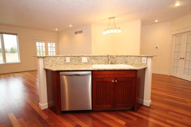 14224 Bridgeview Pointe, Vicksburg, MI 49097 - kitchen featuring stainless steel dishwasher, a sink, dark wood-style floors, a textured ceiling, and recessed lighting