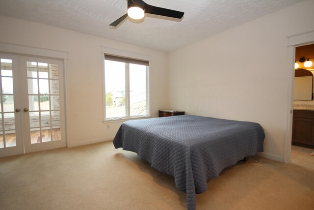 14224 Bridgeview Pointe, Vicksburg, MI 49097 - bedroom with light carpet, access to exterior, baseboards, connected bathroom, and a ceiling fan