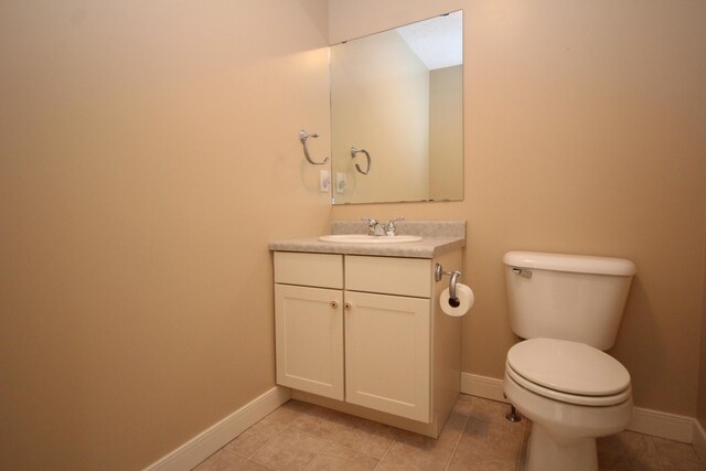 14224 Bridgeview Pointe, Vicksburg, MI 49097 - half bath featuring toilet, vanity, tile patterned flooring, and baseboards