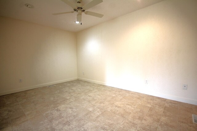 14224 Bridgeview Pointe, Vicksburg, MI 49097 - spare room featuring ceiling fan and baseboards