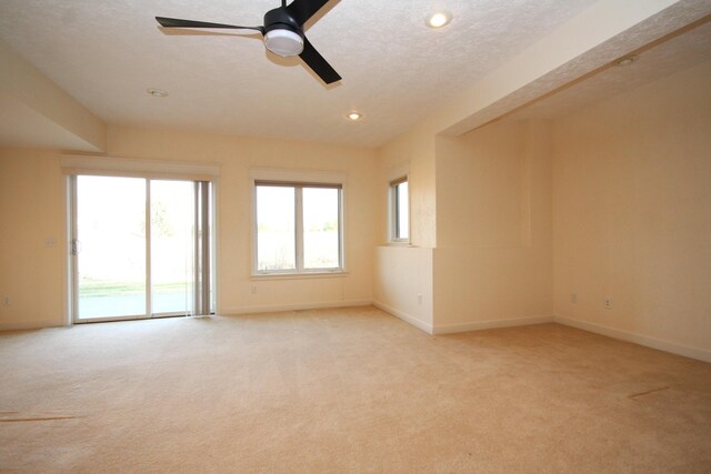 14224 Bridgeview Pointe, Vicksburg, MI 49097 - spare room with light carpet, a ceiling fan, baseboards, and recessed lighting