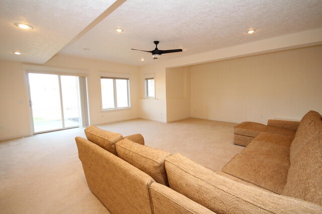 14224 Bridgeview Pointe, Vicksburg, MI 49097 - living area featuring light colored carpet, ceiling fan, recessed lighting, a textured ceiling, and baseboards