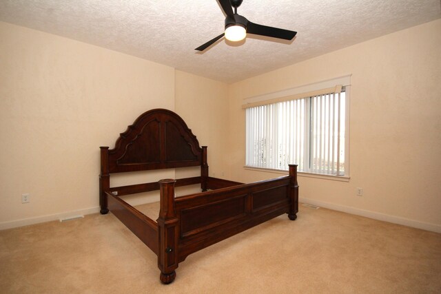 14224 Bridgeview Pointe, Vicksburg, MI 49097 - bedroom with a textured ceiling, light colored carpet, ceiling fan, and baseboards