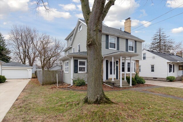 view of front of home featuring a front lawn, a chimney, a shingled roof, and fence