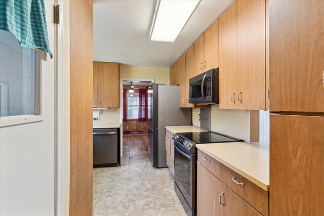 kitchen with light countertops and appliances with stainless steel finishes