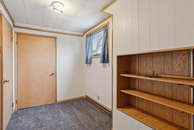 interior space with baseboards and carpet floors