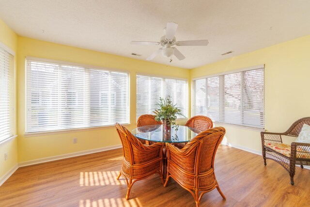 1998 Brighton Ln, Portage, MI 49024 - dining area featuring baseboards, visible vents, light wood-style flooring, and plenty of natural light