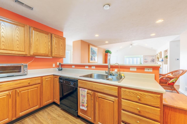 1998 Brighton Ln, Portage, MI 49024 - kitchen featuring light countertops, visible vents, a toaster, dishwasher, and a sink