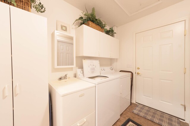 1998 Brighton Ln, Portage, MI 49024 - clothes washing area featuring separate washer and dryer, visible vents, cabinet space, and a sink