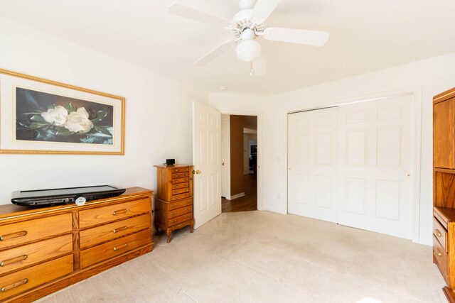 1998 Brighton Ln, Portage, MI 49024 - bedroom featuring light colored carpet, a closet, and a ceiling fan