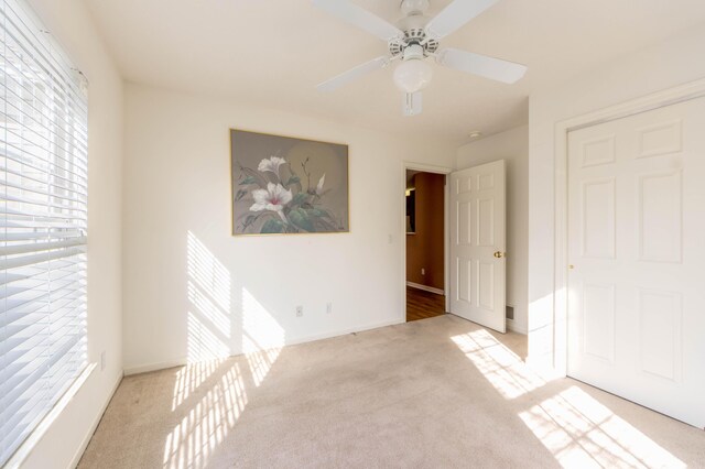 1998 Brighton Ln, Portage, MI 49024 - empty room featuring baseboards, carpet floors, and a ceiling fan
