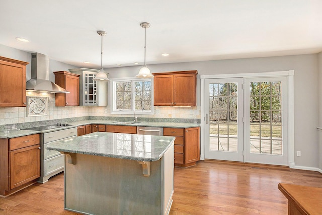 1625 Arlington Blvd, Ann Arbor, MI 48104 - kitchen featuring wall chimney exhaust hood, black electric stovetop, dishwasher, brown cabinetry, and tasteful backsplash