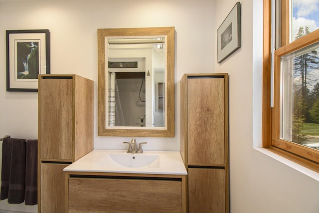 bathroom featuring plenty of natural light and vanity