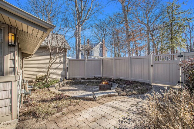 274 Hawley Center Dr, Coldwater, MI 49036 - view of patio / terrace featuring a gate, fence, and a fire pit