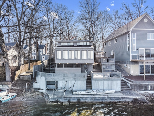 274 Hawley Center Dr, Coldwater, MI 49036 - back of house with stairs, a wooden deck, fence, and a hot tub