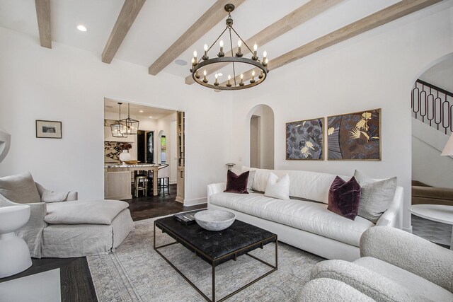 557 Greenwood Ave SE, East Grand Rapids, MI 49506 - living area with recessed lighting, dark wood-style flooring, a chandelier, arched walkways, and beam ceiling