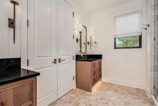 557 Greenwood Ave SE, East Grand Rapids, MI 49506 - bathroom with vanity and baseboards