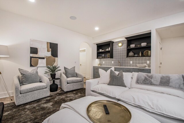 557 Greenwood Ave SE, East Grand Rapids, MI 49506 - living area featuring arched walkways, recessed lighting, and wet bar