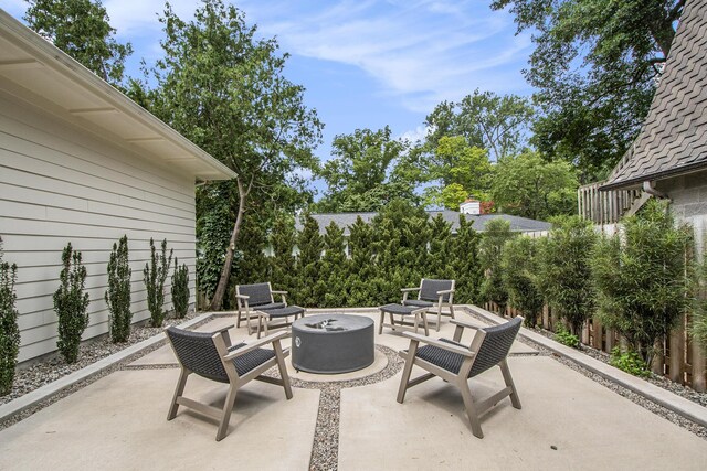 557 Greenwood Ave SE, East Grand Rapids, MI 49506 - view of patio featuring an outdoor fire pit