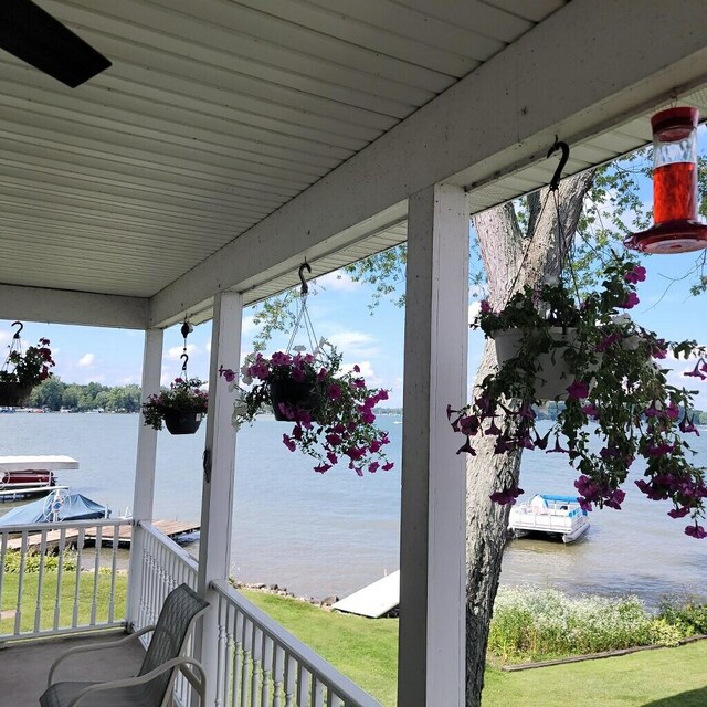 101 Lakeside Dr, Quincy, MI 49082 - wooden deck with a water view
