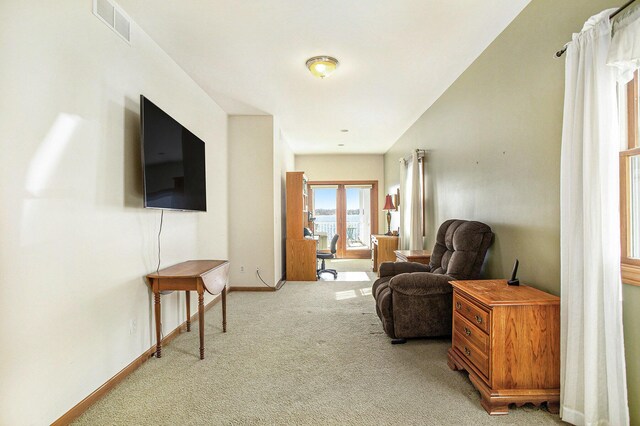 101 Lakeside Dr, Quincy, MI 49082 - living area featuring baseboards, visible vents, and carpet