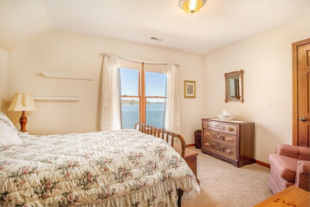 101 Lakeside Dr, Quincy, MI 49082 - bedroom featuring vaulted ceiling, carpet flooring, a water view, baseboards, and visible vents