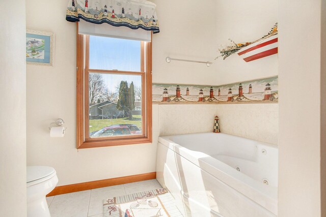 101 Lakeside Dr, Quincy, MI 49082 - full bath with baseboards, a tub with jets, toilet, and tile patterned flooring