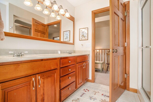 101 Lakeside Dr, Quincy, MI 49082 - full bath with an enclosed shower, double vanity, a sink, and tile patterned flooring