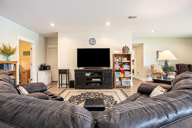 5091 E High Tower Lake Rd, Hesperia, MI 49421 - living area with visible vents, wood finished floors, and recessed lighting