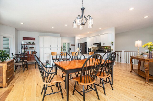 5091 E High Tower Lake Rd, Hesperia, MI 49421 - dining area featuring a chandelier, recessed lighting, and light wood-type flooring