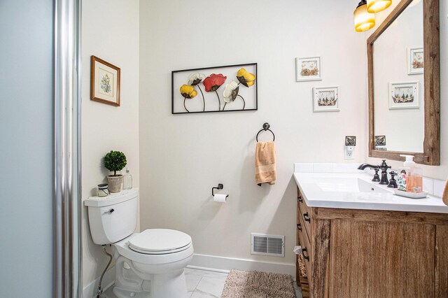 5091 E High Tower Lake Rd, Hesperia, MI 49421 - bathroom with toilet, vanity, marble finish floor, baseboards, and visible vents