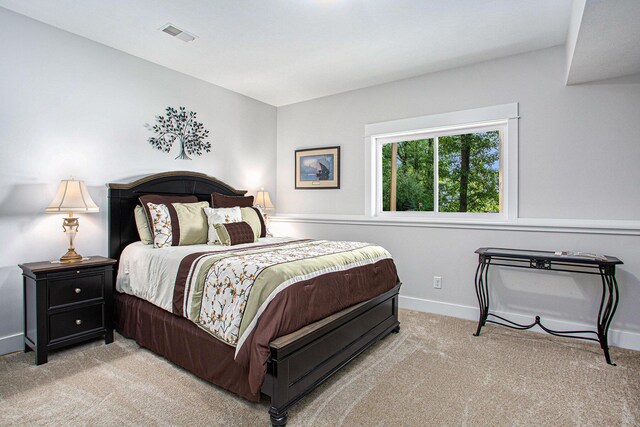 5091 E High Tower Lake Rd, Hesperia, MI 49421 - bedroom featuring carpet, baseboards, and visible vents