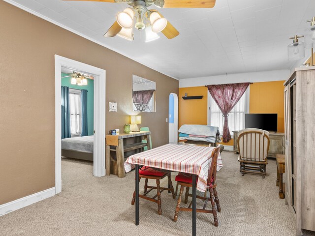 817 E Loomis St, Ludington, MI 49431 - carpeted bedroom with baseboards and a ceiling fan