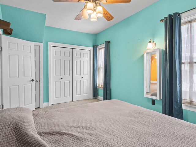 817 E Loomis St, Ludington, MI 49431 - carpeted bedroom with a closet and a ceiling fan