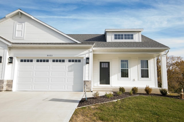 6447 Railbridge Ct SE Unit 26, Caledonia, MI 49316 - view of front of property with a porch, a front yard, roof with shingles, a garage, and concrete driveway