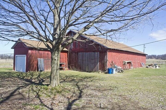 25544 Gage St, Dowagiac, MI 49047 - view of side of property with a barn, a yard, and an outdoor structure