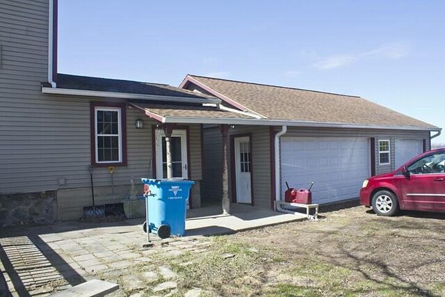 25544 Gage St, Dowagiac, MI 49047 - view of front of home featuring an attached garage and roof with shingles