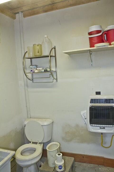 25544 Gage St, Dowagiac, MI 49047 - bathroom featuring heating unit and toilet