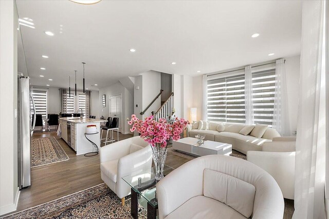 2824 Ridington Rd, Ann Arbor, MI 48105 - living room featuring recessed lighting, stairs, and wood finished floors