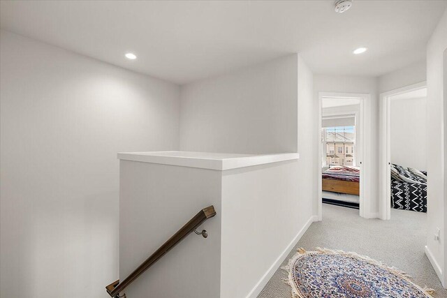 2824 Ridington Rd, Ann Arbor, MI 48105 - hallway featuring baseboards, carpet, recessed lighting, and an upstairs landing