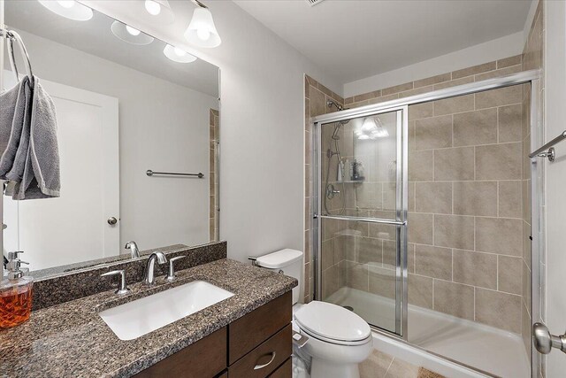 2824 Ridington Rd, Ann Arbor, MI 48105 - bathroom with vanity, a shower stall, and toilet