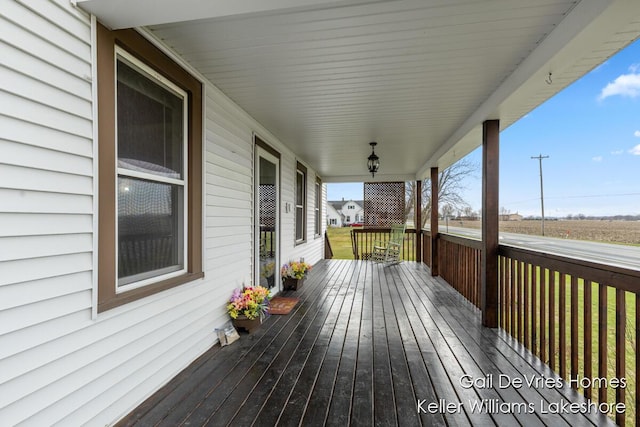 wooden deck featuring covered porch