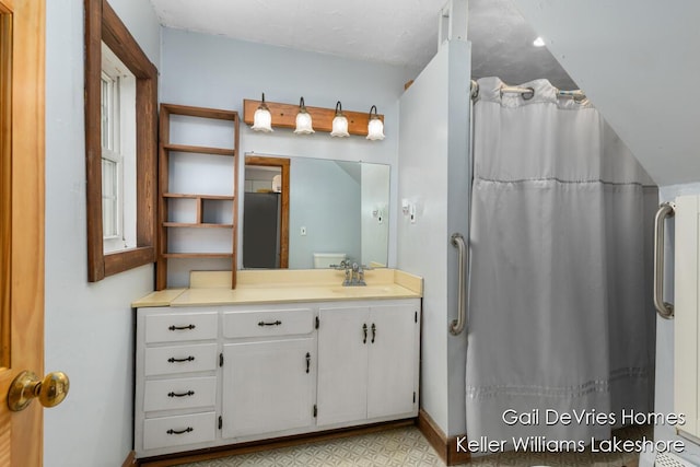bathroom with tile patterned floors, vanity, and a shower with shower curtain