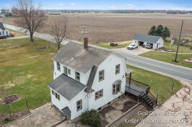 birds eye view of property featuring a rural view