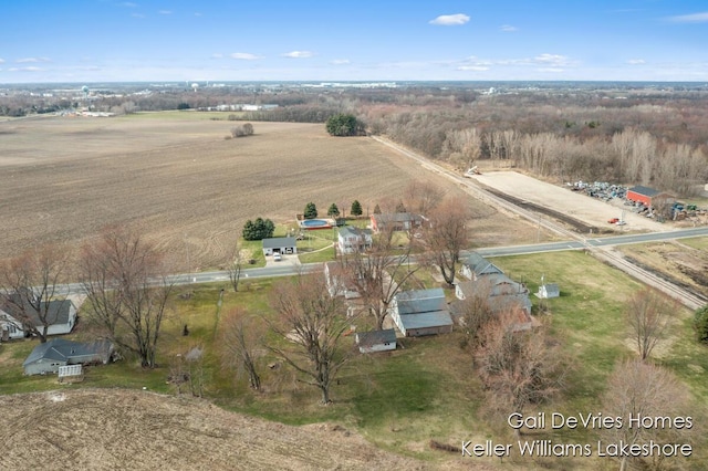 birds eye view of property with a rural view