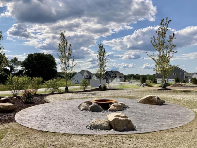 8114 Turning Stone, Kalamazoo, MI 49009 - view of yard featuring a patio and a fire pit