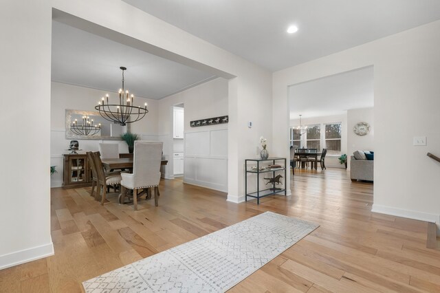 8114 Turning Stone, Kalamazoo, MI 49009 - dining space featuring baseboards, a notable chandelier, and hardwood / wood-style flooring
